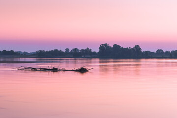 Naklejka premium Water landscape with sunrise at at dawn