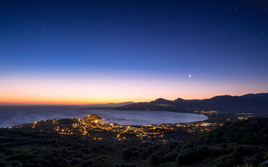 Obraz premium Moon rising over Calvi Bay in Corsica