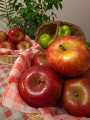 Very delicious and healthy apples, displayed in a beautiful basket for a pleasant picnic.