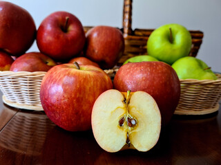 Very delicious and healthy apples, displayed in a beautiful basket for a pleasant picnic.
