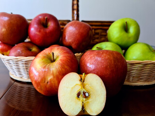 Very delicious and healthy apples, displayed in a beautiful basket for a pleasant picnic.