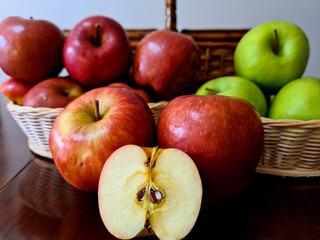 Very delicious and healthy apples, displayed in a beautiful basket for a pleasant picnic.