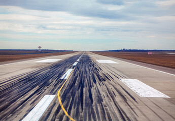 airport runway with traces of landing