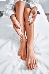 sexy female feet with bath salt - beauty treatment