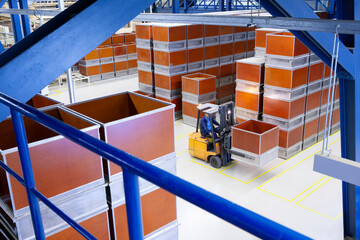 Large warehouse interior with forklift