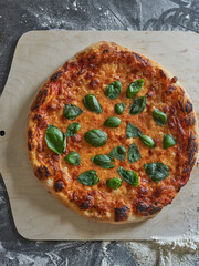 Italian pizza with basil, dark moody and clean shot,