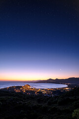 Moon rising over Calvi Bay in Corsica