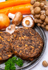 Tasty vegetarian food, burgers with champignons mushrooms, buna shimeji, carrot and onion