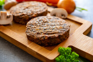 Tasty vegetarian food, burgers with champignons mushrooms, buna shimeji, carrot and onion