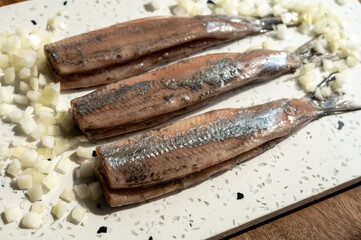 Season of new Dutch herring fresh salted fish ready to eat, traditional food in Netherlands