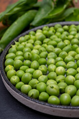 New harvest of ripe green peas legumes