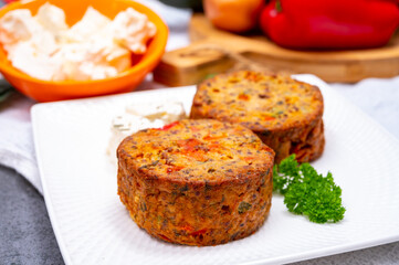 Tasty vegetarian food, burgers with Greek feta cheese, sweet red paprika, green olives and zucchini