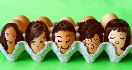 Faces on the eggs, handsome, confident man with women in love with him, love concept with eggs 