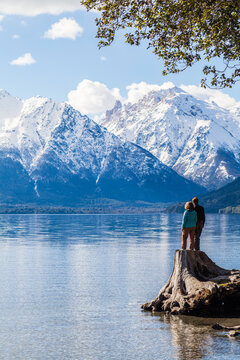 A young couple enjoying some amazing views of the mountains in Patagonia, near Bariloche in Argentina