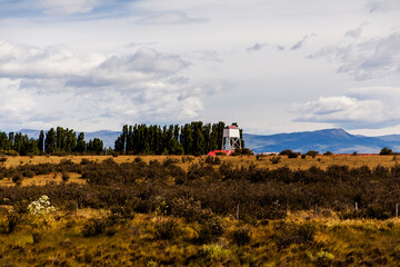 landscape with a field and lighthouse