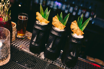 ice cold modern Cocktail  gourmet craft white with Sweet caramels decoration slice Author Drink - on bar counter . Close-up Top view . Copy paste space design barman people and luxury nightclub