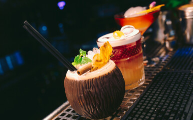 ice cold modern Cocktail  gourmet craft white with Sweet caramels decoration slice Author Drink - on bar counter . Close-up Top view . Copy paste space design barman people and luxury nightclub