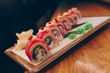 Large set of Sushi Rolls Warm Ebi Sake Unagi Spring. Assortment Philadelphia roll Dishes from Japanese raw fish in one plate in luxury traditional restaurant. Japan food menu service