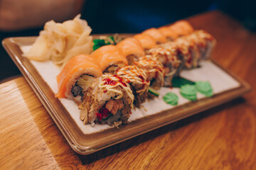 Large set of Sushi Rolls Warm Ebi Sake Unagi Spring. Assortment Philadelphia roll Dishes from Japanese raw fish in one plate in luxury traditional restaurant. Japan food menu service