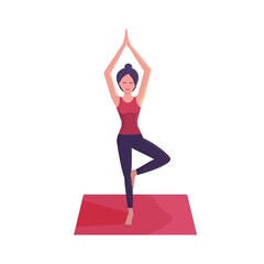 Smiling young woman practicing yoga, doing yoga exercise on pink mat, standing in tree pose, yoga pose, Vrksasana
