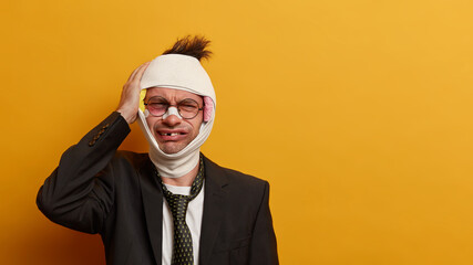 Bruised injured adult man becomes victim of street gangs, beaten and has head trauma after...
