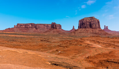 Fototapeta na wymiar A panorama view of Merrick Butte, Elephant Butte, East Mitten Butte and West Mitten Butte in Monument Valley tribal park in springtime