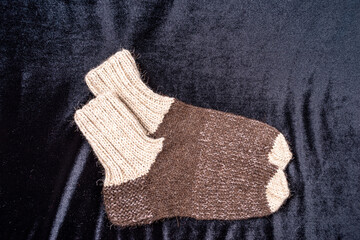 Socks knitted from wool thread on spokes by hand
