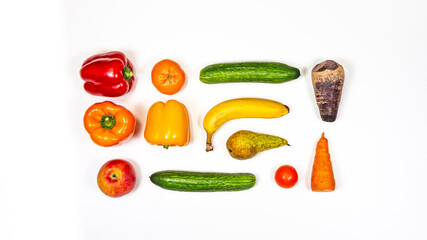 Tomato, cucumber, sweet peppers, tangerine, banana, pear, Apple, carrot, beetroot on a white background, top view