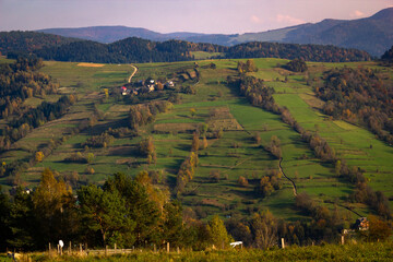 Village Lomnica-Zdroj in southern Poland. Beskid Sadecki Mountains in autumn.
