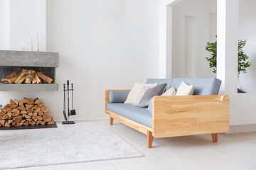 Luxury fashionable modern design studio apartment with a free layout in a minimal style. very bright huge spacious room with white walls and wooden elements. sitting area with fireplace