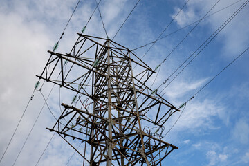 High voltage power transmission line. Industrial background with high voltage tower on the...