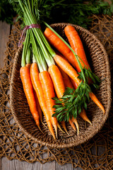 fresh ripe carrots in a basket