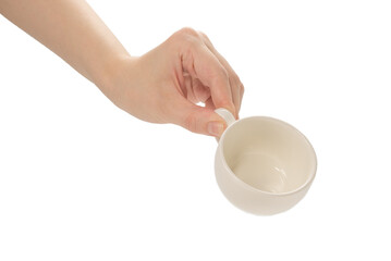 Empty coffee cup in woman hand isolated on white.