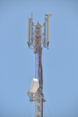 Naklejka premium High telephone tower. Beautiful sky with a communications tower in the foreground.Abu dhabi,UAE.16.06.2020.