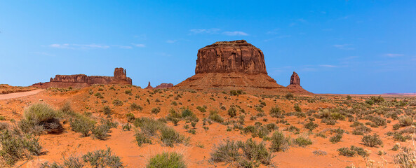 Merrick Butte, East Mitten Butte and West Mittens Butte viewed from behind in Monument Valley tribal park in springtime