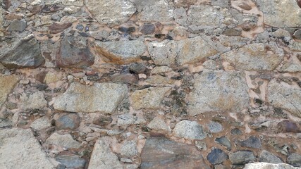Ancient wall structure at Dutch fort in Galle. Wall texture from rubble and limestone.