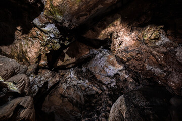 Inside the mysterious flowstone cave 'Nebelhöhle' with stalagmites and stalactites in Germany.