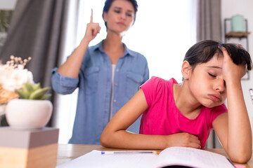 a mother not happy because her daughter does not do her school homework