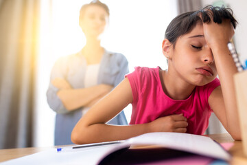 a mother not happy because her daughter does not do her school homework