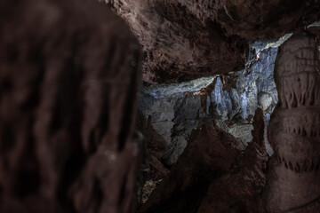 Inside the mysterious flowstone cave 'Nebelhöhle' with stalagmites and stalactites in Germany.