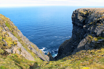 Cliff and sea and sky and horizon and North Cape