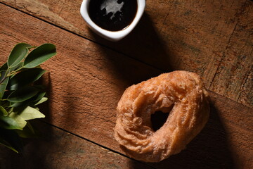 cup of coffee sugar donut hand grabbing