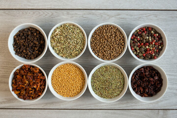 Dry seasonings and spices against a dark background view from the top.