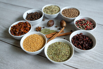 Dry seasonings and spices against a dark background view from the top.