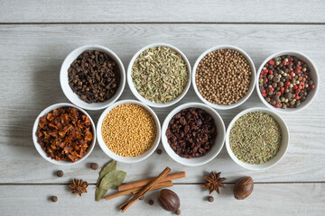 Dry seasonings and spices against a dark background view from the top.