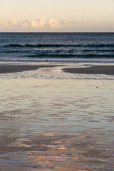 Sunset on the beach. Waves on the ocean. Selective focus. 