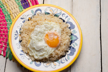 Fried egg with rice on white background