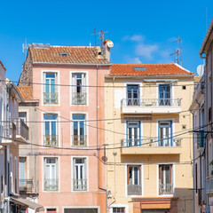 Béziers in France, colorful houses, typical facades in the old center
