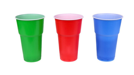 Set of plastic cups isolated. Red, green and blue plastic glasses