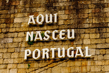 Here was born Portugal letters on the wall, Historic Centre of Guimaraes, Portugal. UNESCO World Heritage
